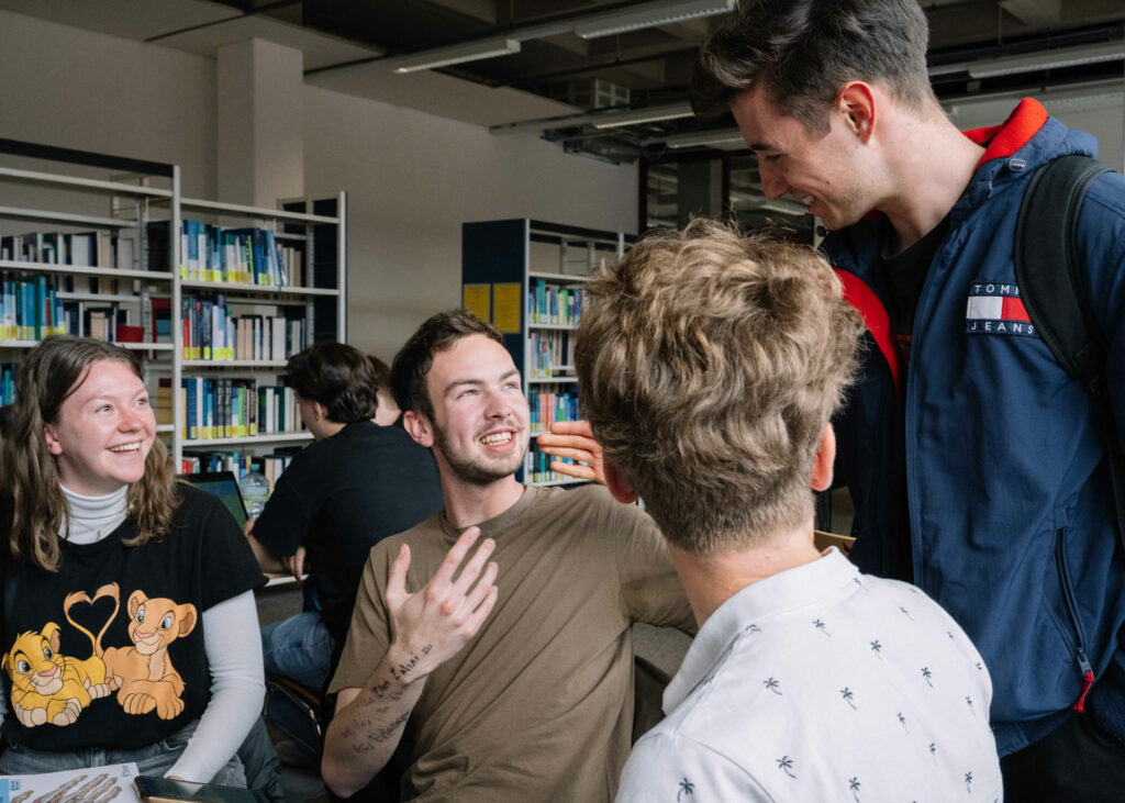 Students talking in library